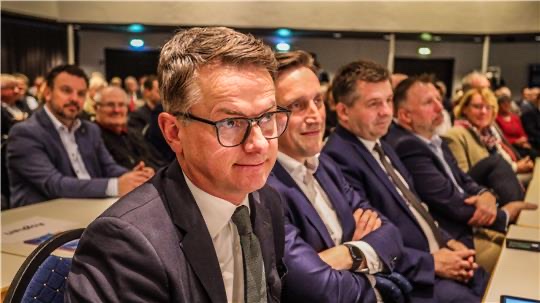 Carsten Linnemann seated in the audience at an event in Goslar