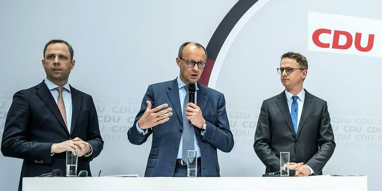 CDU press conference with Friedrich Merz speaking in the centre and Carsten Linnemann on the right, CDU logo in the background